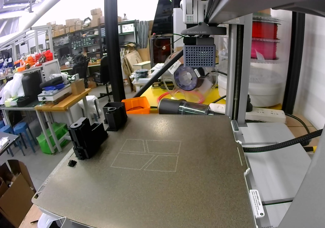 A frame from a 3D printer's own camera during a print on our farm